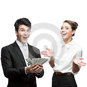 Young happy business people holding money