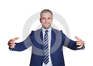 Young happy businessman holds something isolated on white