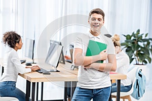 young happy caucasian student boy in classroom