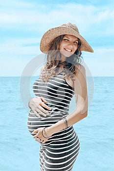 Young happy cheerful pregnant woman smilling and enjoing life in photo