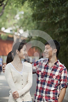 Young Happy Chinese Couple Walking In Jing Shan Park photo