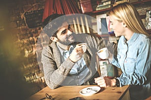 Young happy couple at cafe.