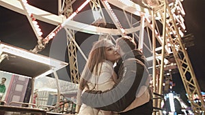 Young happy couple on date in lunapark. Romantic date and first love.