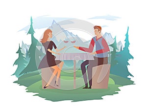 Young happy couple on a date. Man and woman drink wine at a romantic dinner. Forest and mountain landscape in the