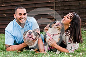 Young Happy Couple with English Bulldogs