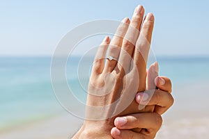 Young Happy Couple Is Getting Engaged In Wedding Proposal On Beach