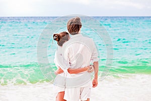 Young happy couple having fun on tropical beach. honeymoon