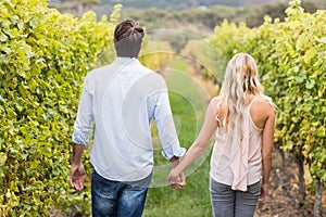 Young happy couple holding hands