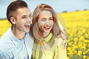 Young happy couple Hugging and Laughing.