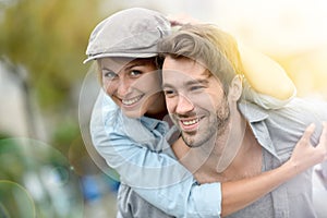 Young happy couple in love having fun outdoors