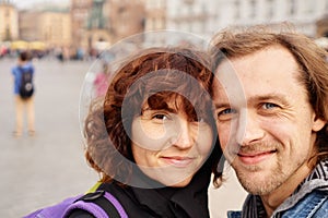 Young happy couple making selfie during European travel