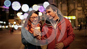 Young happy couple man and attractive girl walking