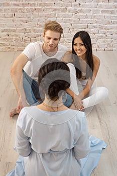 Young happy couple on reception for family psychologist