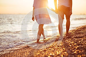 Young happy couple on seashore.