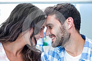 Young happy couple smiling at each other