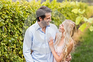 Young happy couple smiling at each other