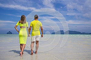 Young happy couple on tropical beach at summer vacation. Thailand