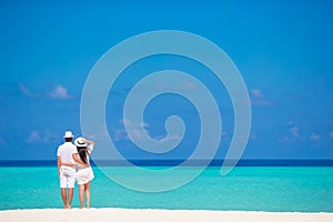 Young happy couple on white beach at summer photo
