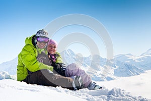 Young happy couple in winter mountains