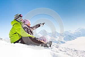 Young happy couple in winter mountains