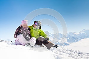 Young happy couple in winter mountains