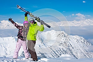 Young happy couple in winter mountains