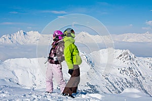 Young happy couple in winter mountains