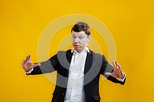 Young happy crazy businessman showing big size gesture with hands, emphasizing great amount of something