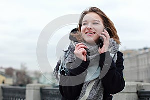 Portrait of young smiling successful business woman. People, cute, outdoor.