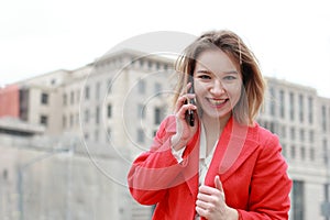 Portrait of young smiling successful business woman. People, cute, outdoor.