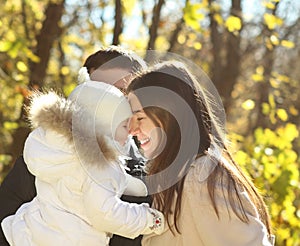 Young happy family in autumn park