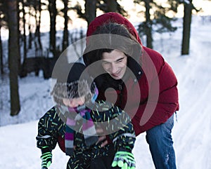 Young happy father with his son little cute boy outside in winter park, lifestyle people concept