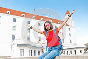 Happy female tourist in Bratislava city near Castle or Hrad. Travel in Slovakia and Europe Union concept