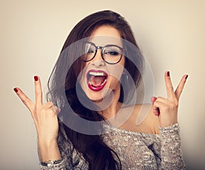 Young happy female woman in glasses with open wide mouth showing