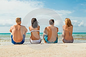 Young happy friends havin fun on the beach