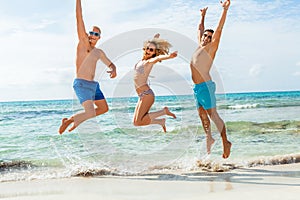 Young happy friends havin fun on the beach