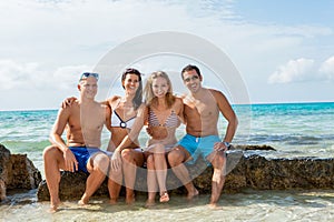 Young happy friends havin fun on the beach