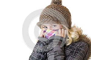 Young happy girl with cap, scarf and jacket