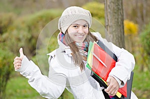 A Young Happy Girl coming from school