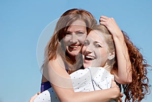 A young happy girl with mother