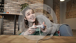 Young happy girl play video game