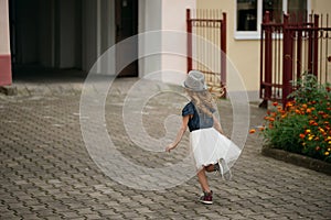Young happy girl running away