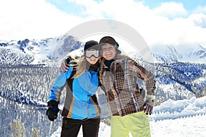 Young happy girls in winter clothes and goggles