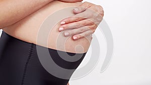 Young, happy and healthy pregnant woman on white background. Studio video. Baby expectation, pregnancy and motherhood