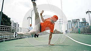 Young happy hipster perform break dancing or foot step with friend. Sprightly.