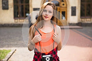 Young happy hipster teenage girls taking pictures and having fun in summer park