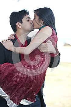 Young Happy Indian Couple Kissing