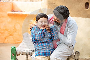 Young happy indian father having fun with is cute little son. Beard man playing with kid, Child laughing,