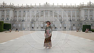 Young happy Indonesian woman from Bali having vacation in Europe - beautiful and cheerful Balinese tourist girl in traditional