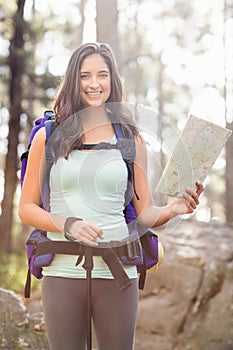 Young happy jogger looking at camera